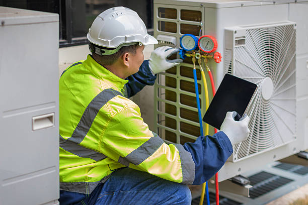 Professional Hvac technician working in Island Park, NY